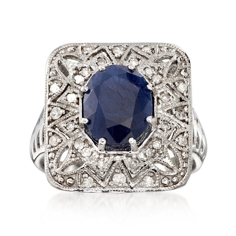 Sterling silver openwork ring with dark blue sapphire and diamond accents