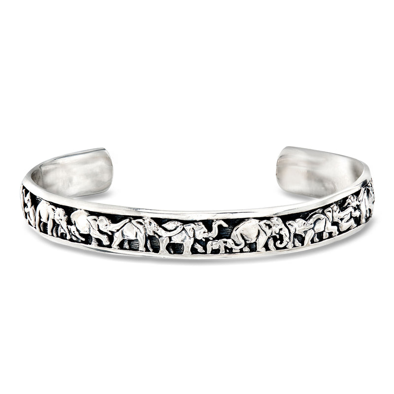 Sterling silver elephant cuff bracelet with engraved elephant figures along the band