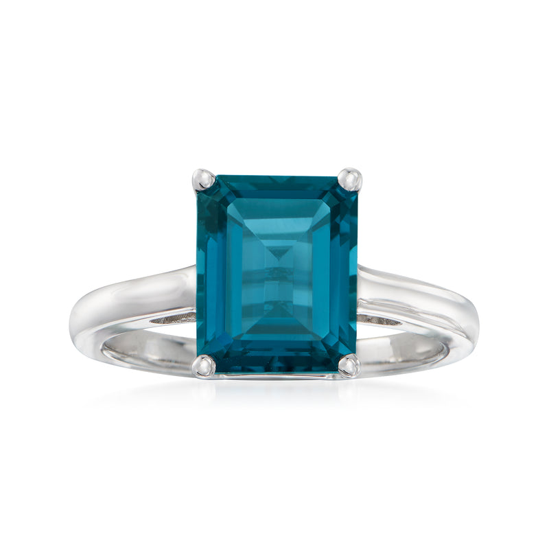 Sterling silver ring with emerald-cut blue topaz, four-prong setting