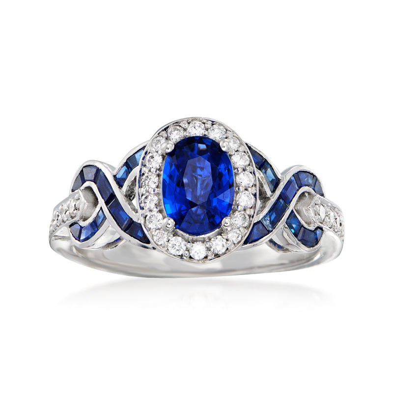14kt white gold sapphire and diamond ring with oval blue center and diamond halo