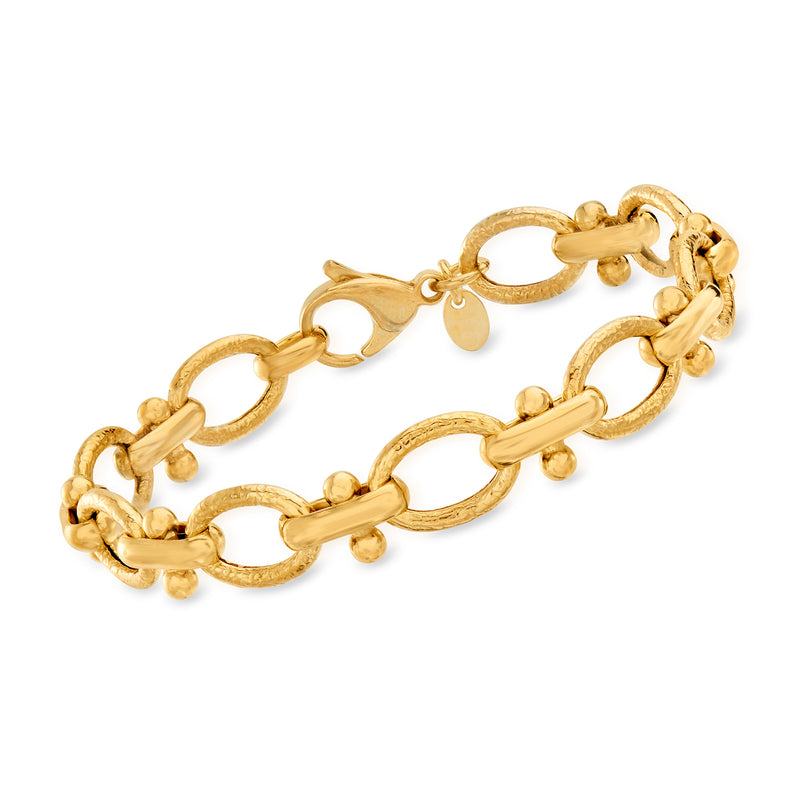 Gold over sterling link bracelet with oval and round charm links