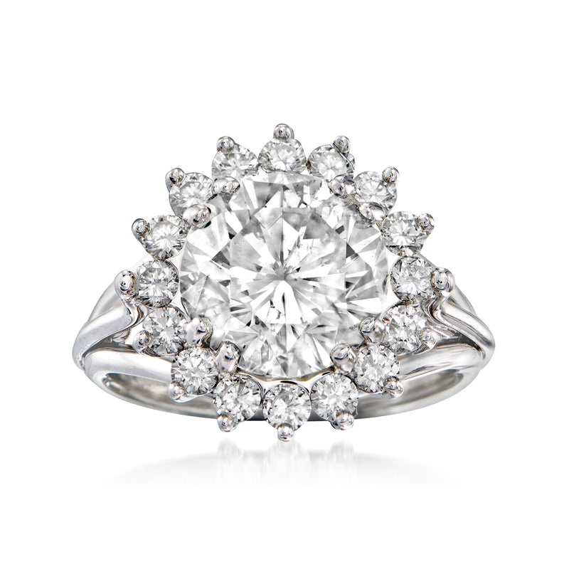 18kt white gold diamond halo ring with large round center stone and teardrop side stones