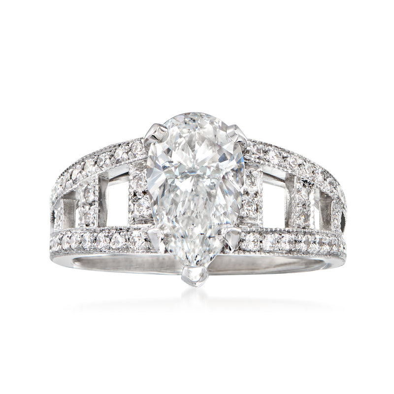 18kt white gold diamond ring with round center stone and halo of small diamonds