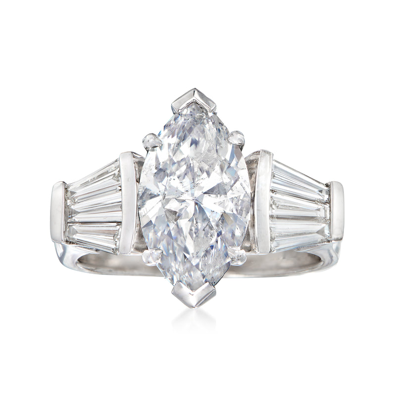 18kt white gold diamond ring with emerald-cut center and baguette side stones
