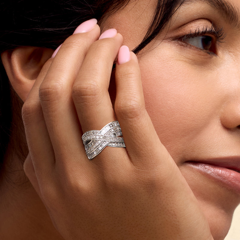 Sterling silver diamond highway ring on hand, crisscross baguette and round stones