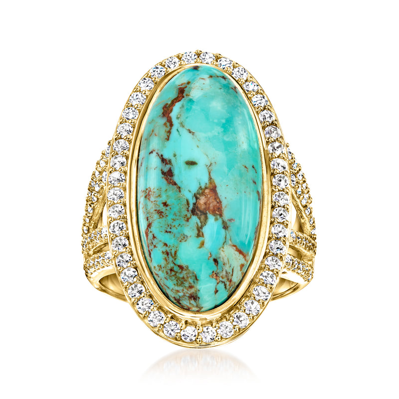 Oval turquoise cabochon ring with diamond halo and double row shoulders in gold
