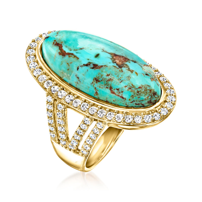 Turquoise oval center stone ring with diamond border and openwork gold band