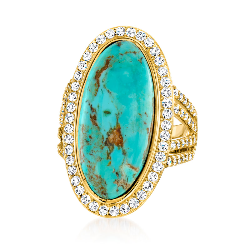 Turquoise oval cabochon ring with round-cut diamond halo, ornate gold setting
