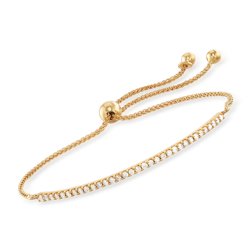 Curved bar bolo bracelet in gold with small diamond-like stones