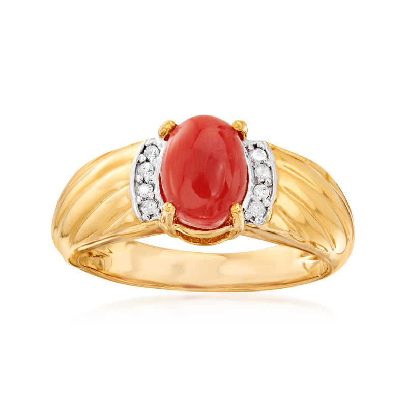 Gold ring with oval coral cabochon and diamond-accented side settings