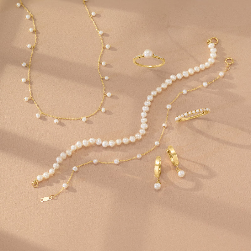 Yellow gold cultured pearl necklace with tiny round pearls and delicate chain