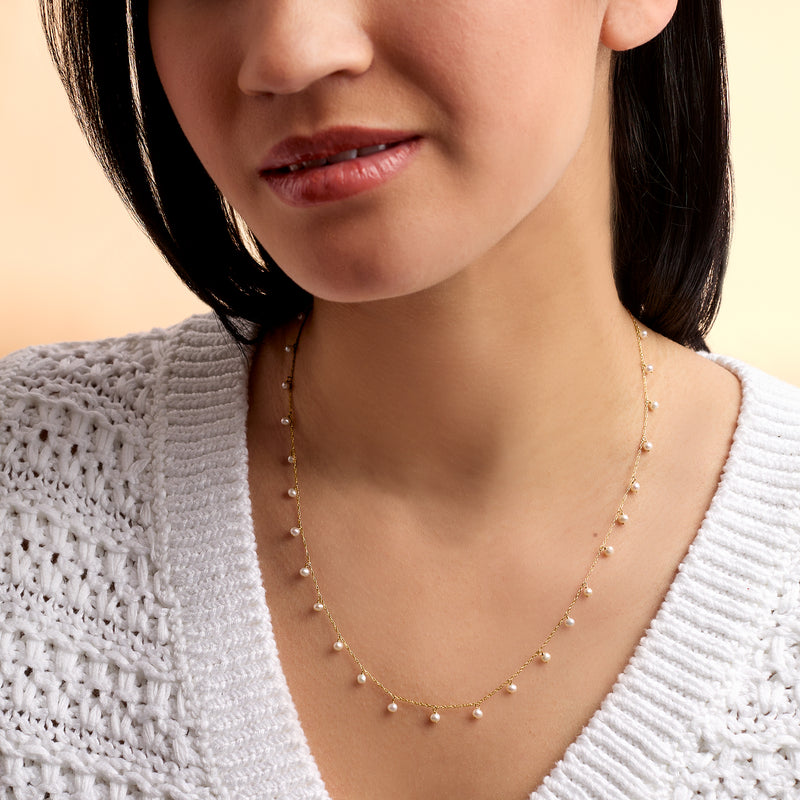 Cultured pearl necklace in 14kt yellow gold, small round pearls in a single strand
