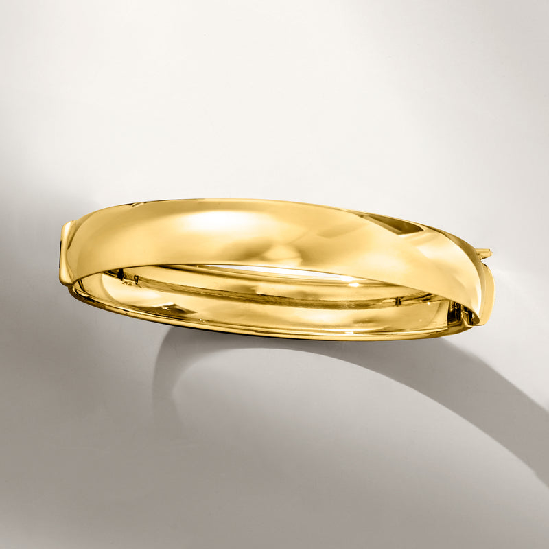 Polished 14kt yellow gold bangle bracelet, side view with clasp detail