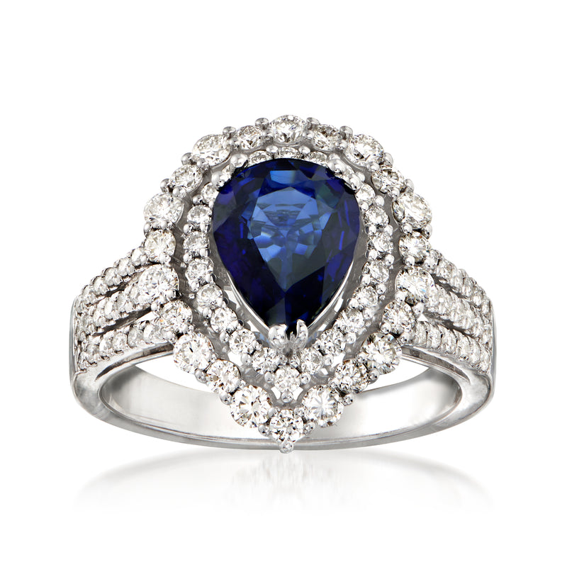 14kt white gold halo ring with pear-shaped dark blue sapphire and diamond clusters