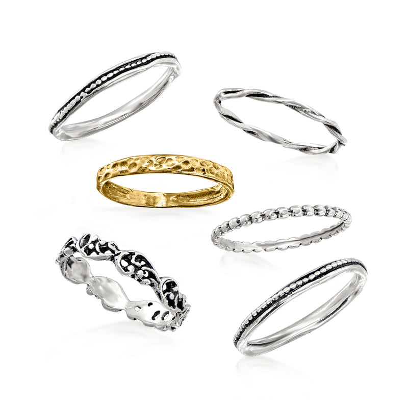 Assorted textured rings: hammered gold band, twisted silver band, bead-edge silver rings