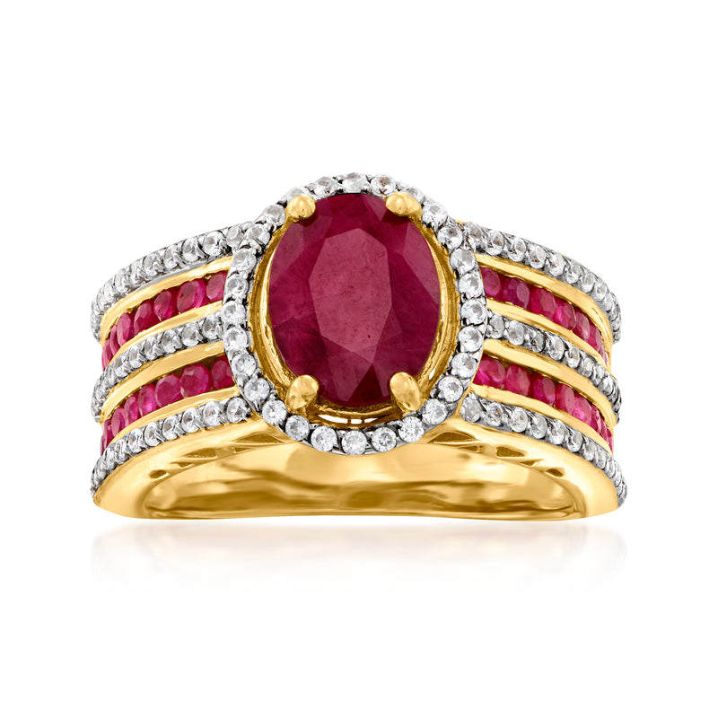 Oval deep red gemstone ring with clear halo, gold band, pink and white stone rows