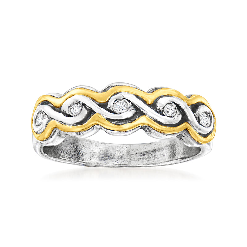 Sterling silver swirl ring with yellow gold accents and diamond stones