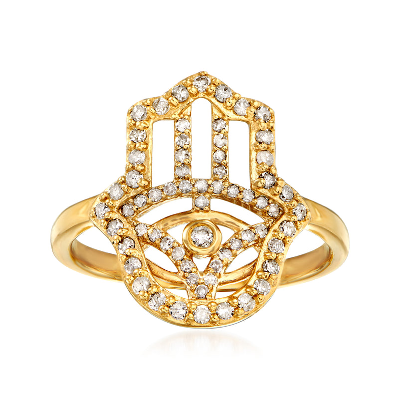 Gold hamsa diamond ring with central eye motif and halo of clear stones