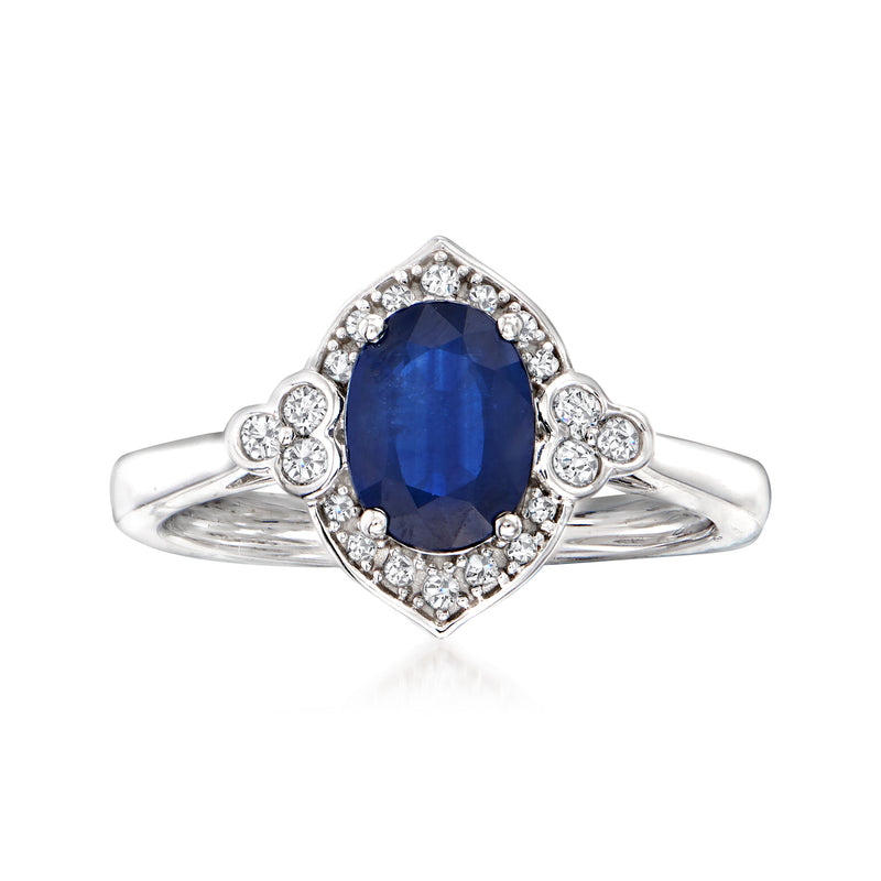 14kt white gold sapphire ring with oval blue center stone and diamond halo