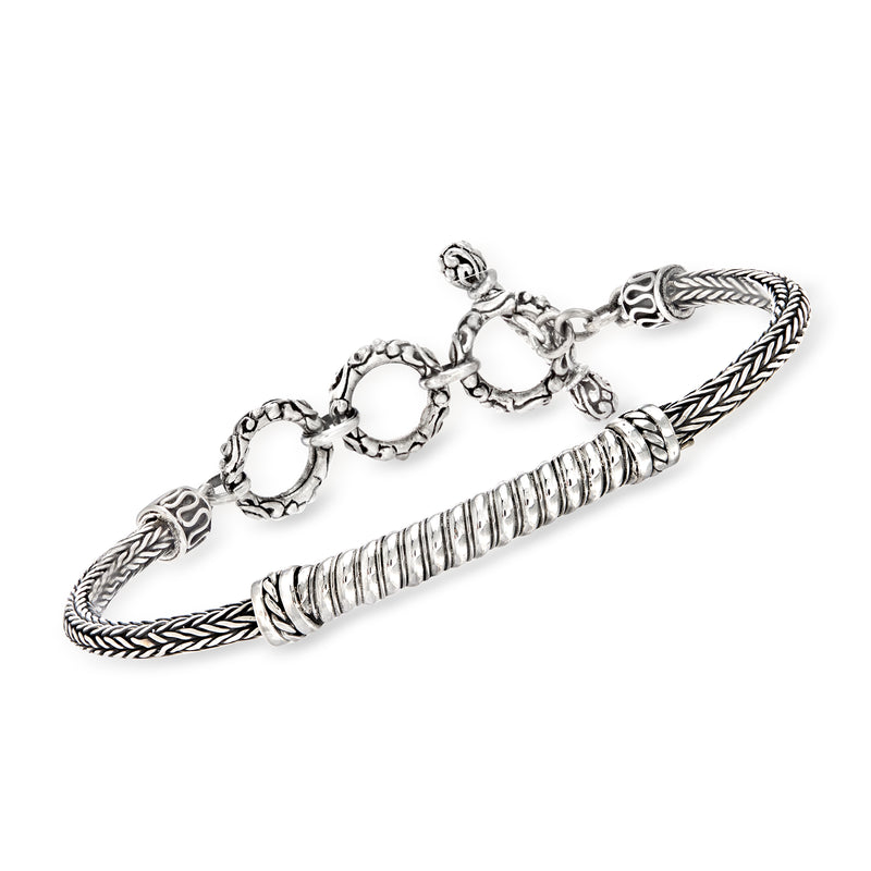 Sterling silver Bali-style wheat-link bracelet with ridged center and rope clasp ends