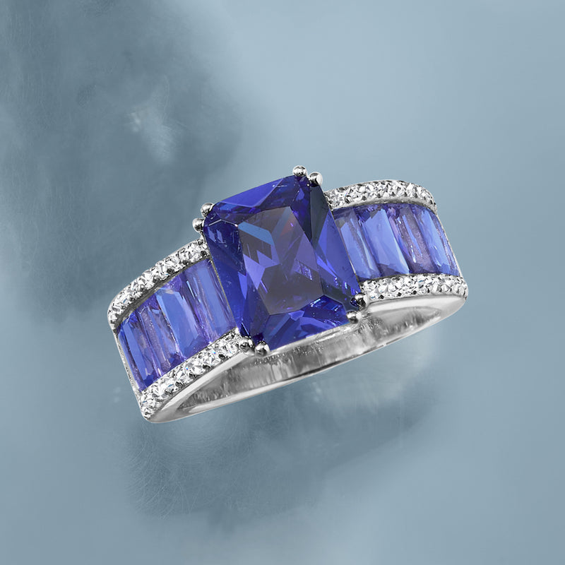 Sterling silver ring with rectangular simulated blue tanzanite stone and white CZ edging
