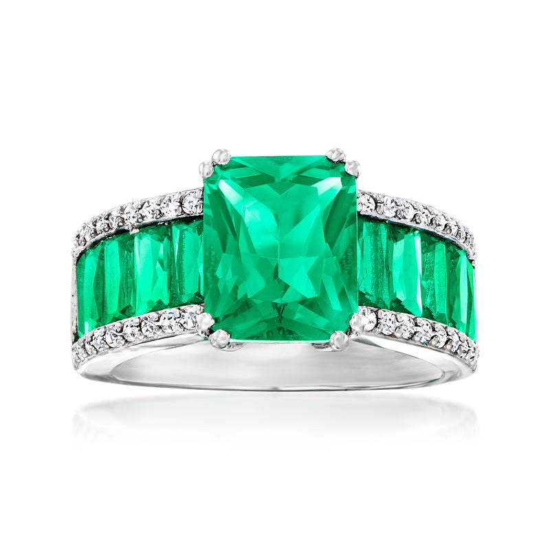 Sterling silver ring with emerald-cut green simulated stones and CZ accents