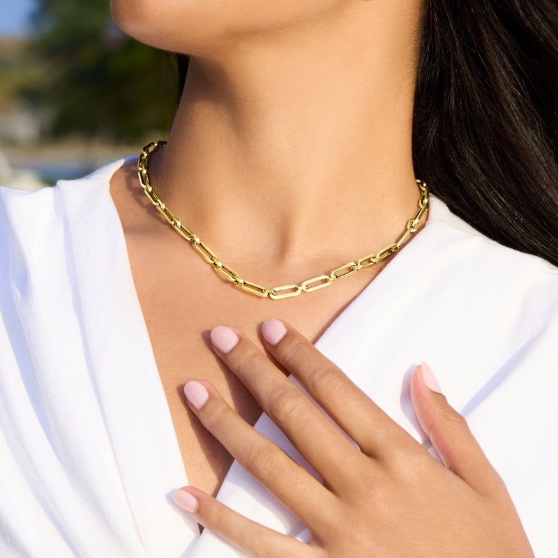 Yellow gold paper clip link necklace on model, alternating links with polished shine