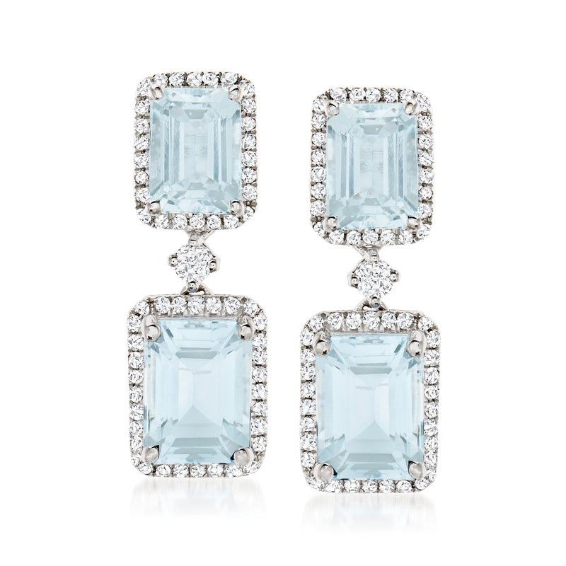 White gold drop earrings with light blue aquamarine and diamond halo and dangling frame