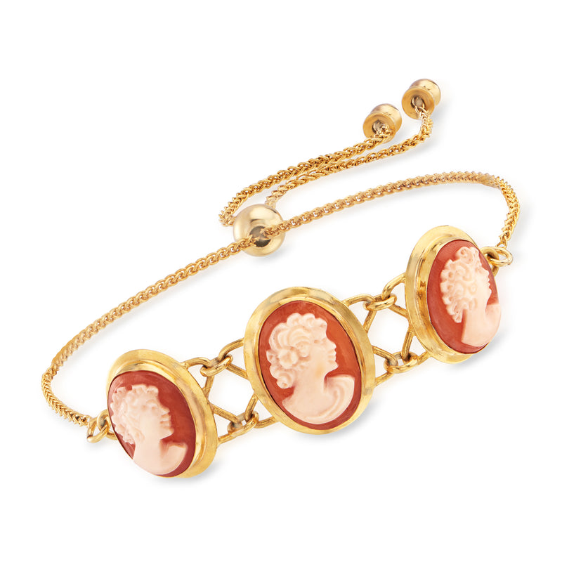 Gold-tone bolo bracelet with round orange shell cameo profiles on linked chain