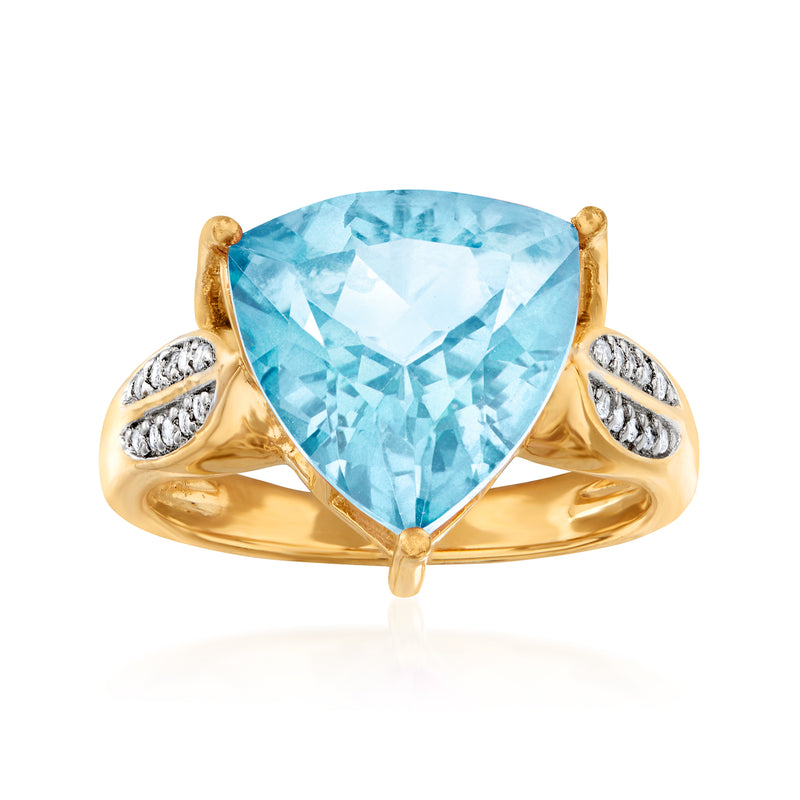 Gold over sterling ring with large sky-blue topaz center and white topaz side accents