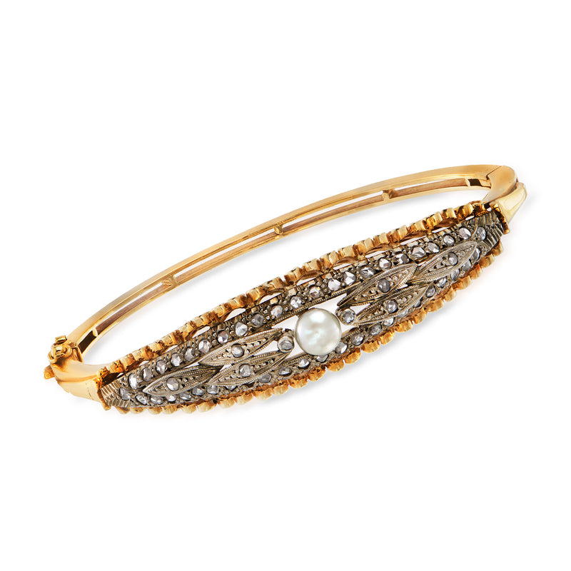 Two-tone gold bangle bracelet with cultured pearl center and diamond-set accents