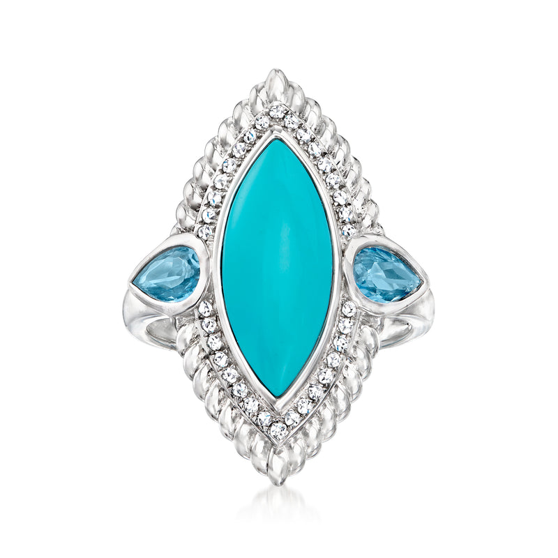 Sterling silver ring with oval turquoise center and blue topaz side stones, halo