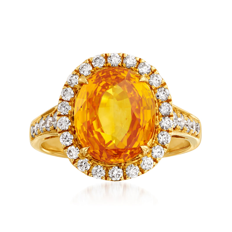 18kt yellow gold ring with oval yellow sapphire and diamond halo
