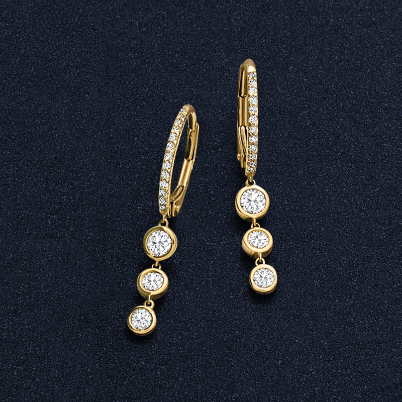 Yellow gold diamond hoop drop earrings with three round dangling stones