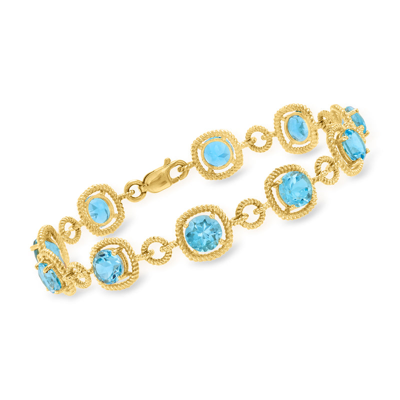 Gold-tone bracelet with blue oval gemstones in circular bezel settings