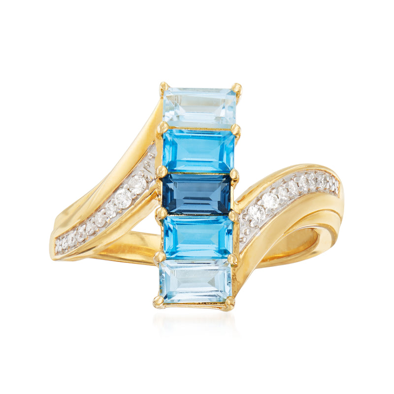 Gold ring with rectangular blue topaz center and diamond side accents
