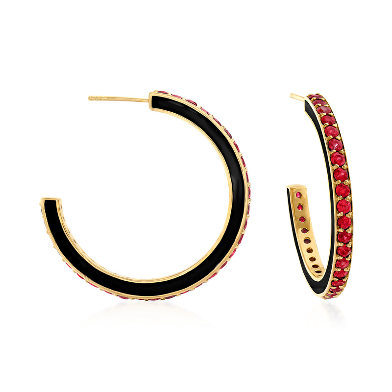 Gold hoop earrings with black enamel and red gemstone accents