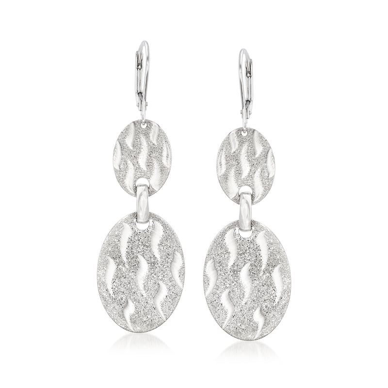 Sterling silver oval drop earrings with textured leaf-like discs and leverback closure.