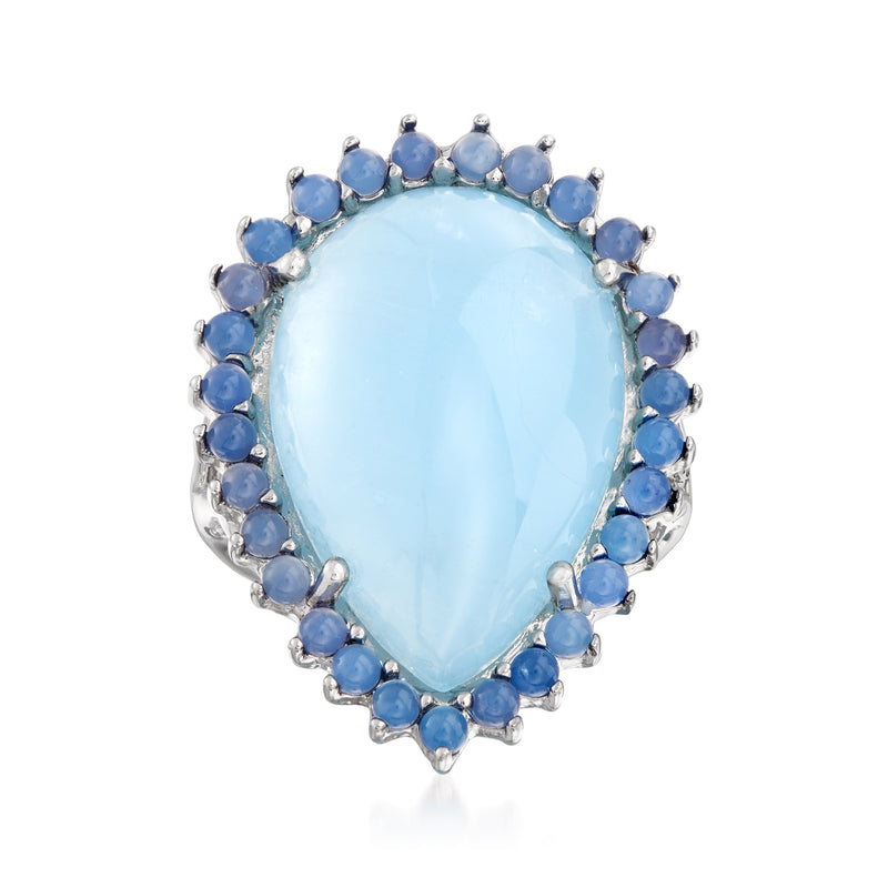 Sterling silver cocktail ring with oval milky aquamarine center and blue gemstone halo