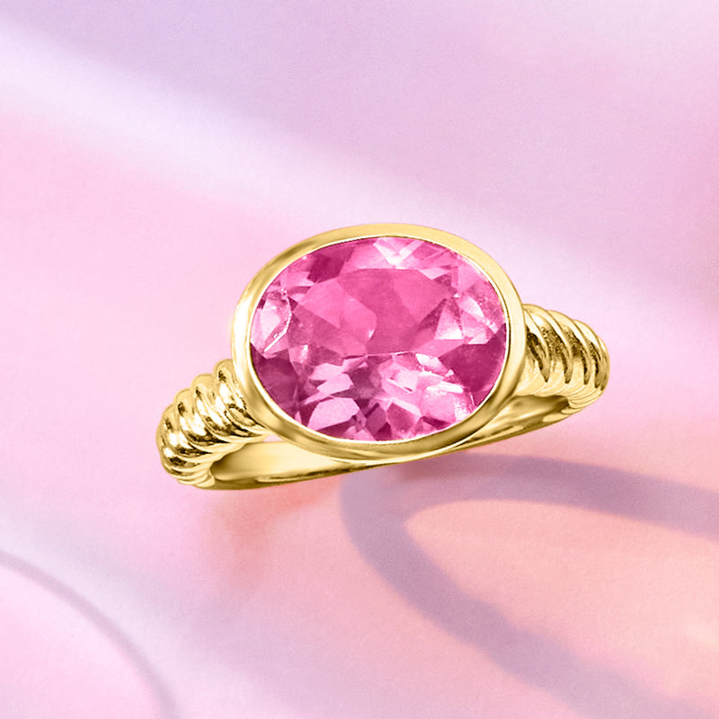 Gold over sterling ring with oval pink gemstone and twisted rope band