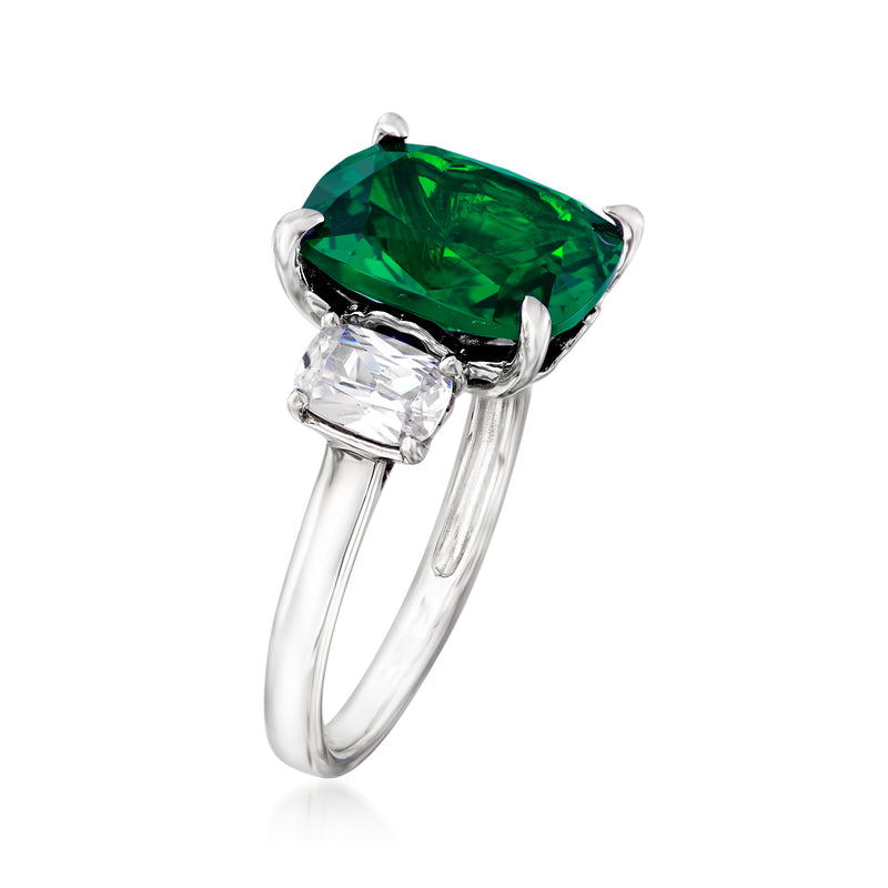 Sterling silver three-stone ring with green emerald-cut center and clear side CZ stones