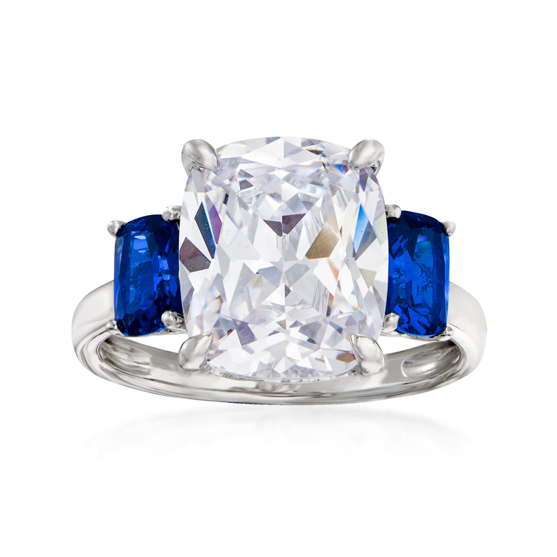 Sterling silver three-stone ring with large clear center stone and blue side stones