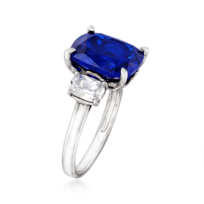 Sterling silver ring with tilted blue center stone and two clear side CZ stones