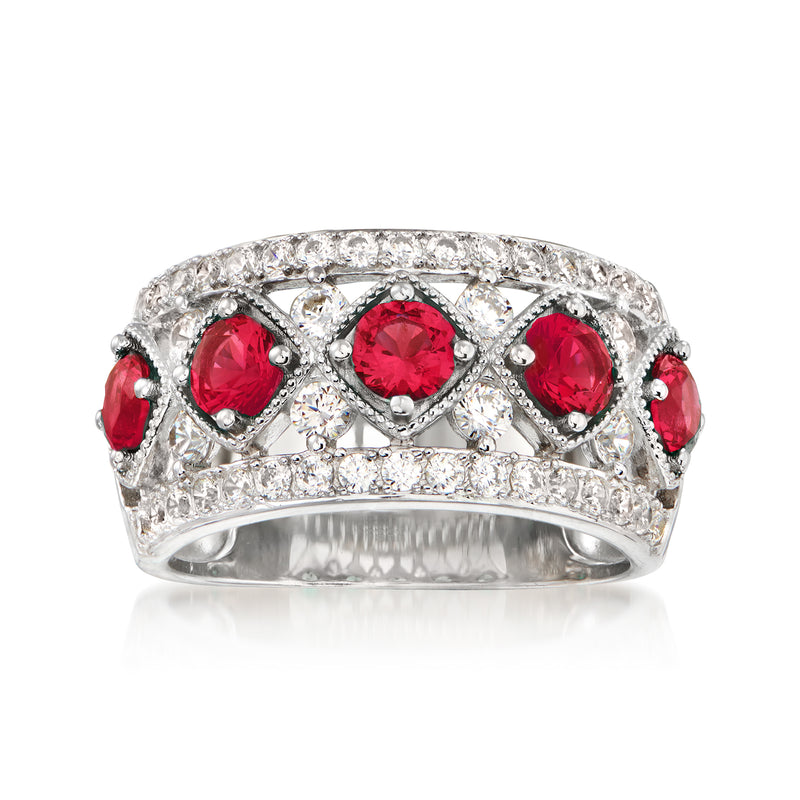 Sterling silver ring with red simulated ruby CZ and clear round stones in a halo band