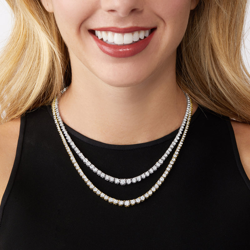 Graduated diamond tennis necklace close-up with round stones and scalloped spacing