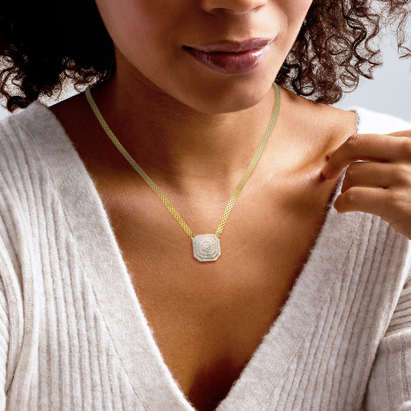 Gold chain diamond cluster necklace with octagon pendant worn on model