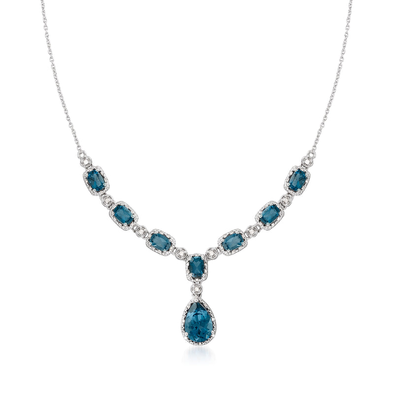 Sterling silver necklace with blue topaz and diamond accents, pear drop pendant