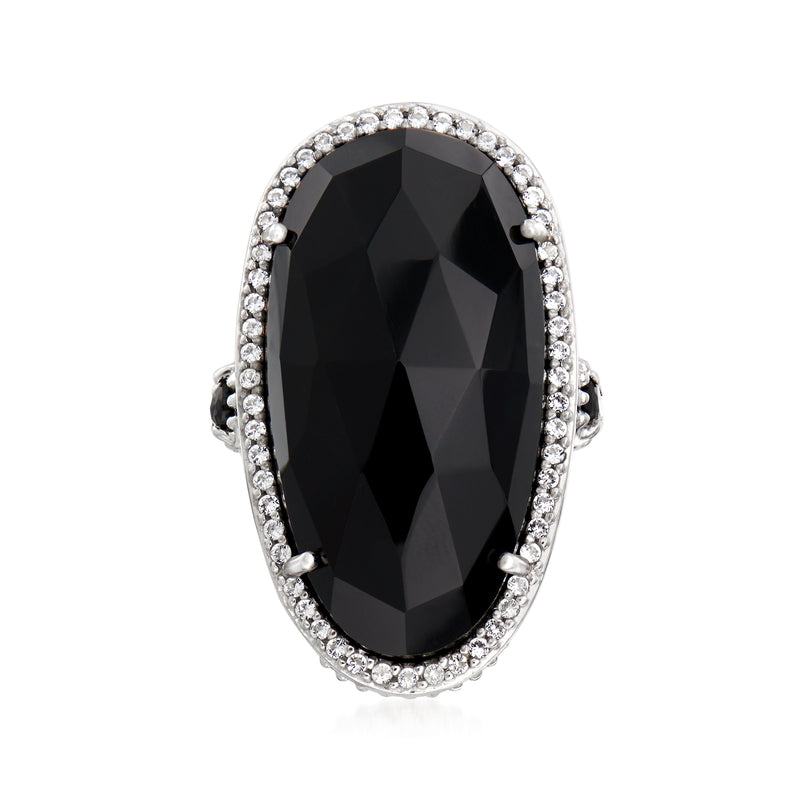 Black onyx cocktail ring in sterling silver with oval white topaz halo