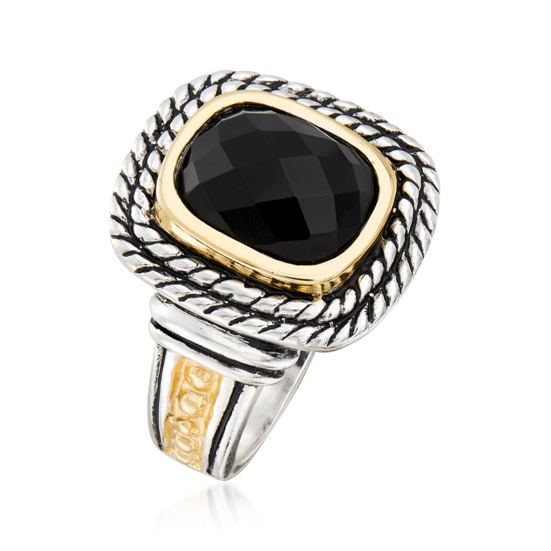 Oval black gemstone ring with rope-textured silver band and yellow gold frame