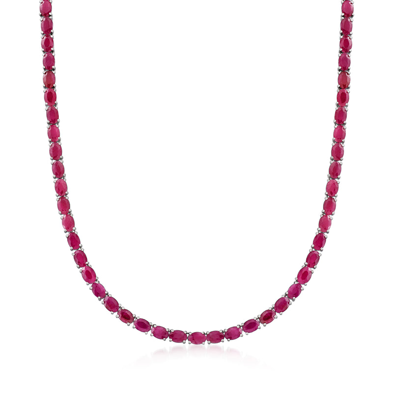 Ruby tennis necklace in sterling silver with oval pink stones in a continuous row